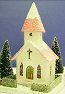 Click to learn how to build vintage-style glittered pasteboard buildings.